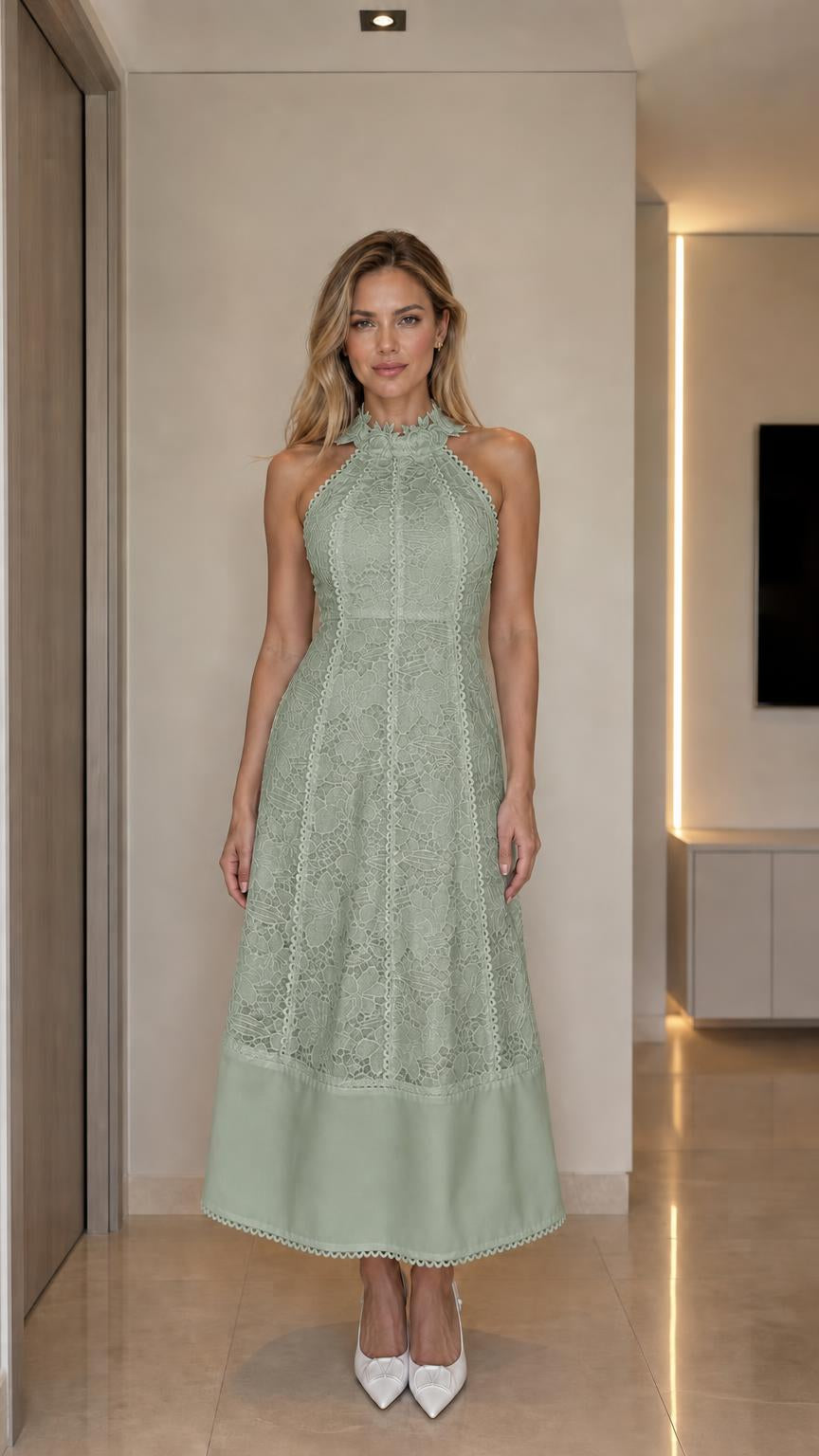 Front view of woman wearing sage green halter neck lace midi dress