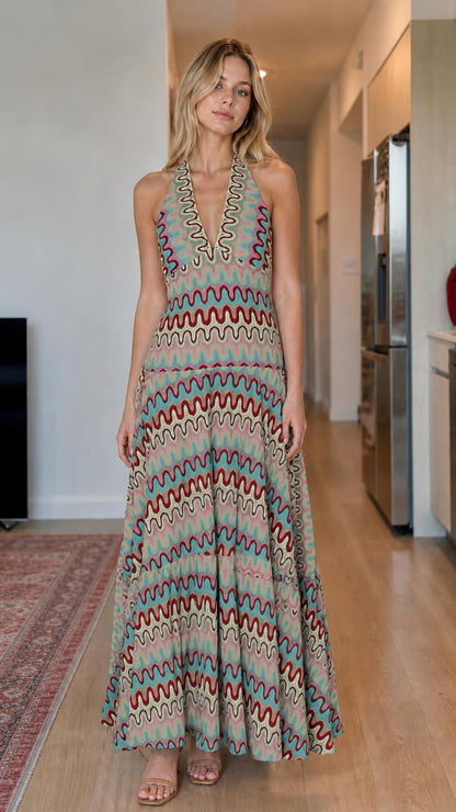 Model wearing sage multi wave pattern halter maxi dress