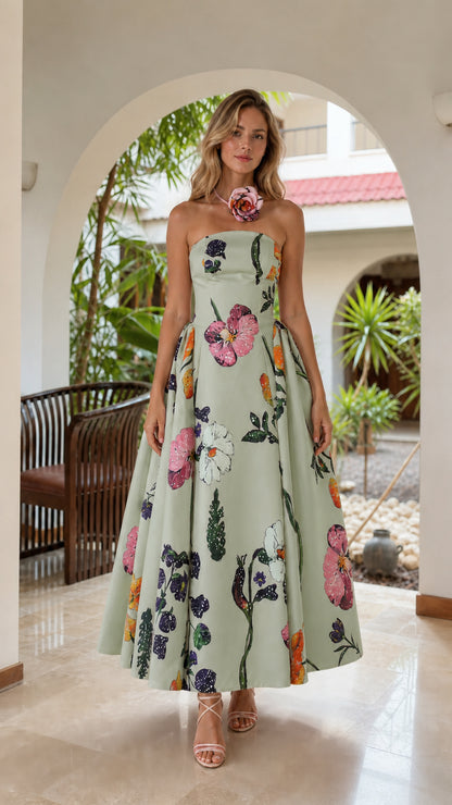 Model wearing sage green floral strapless midi dress