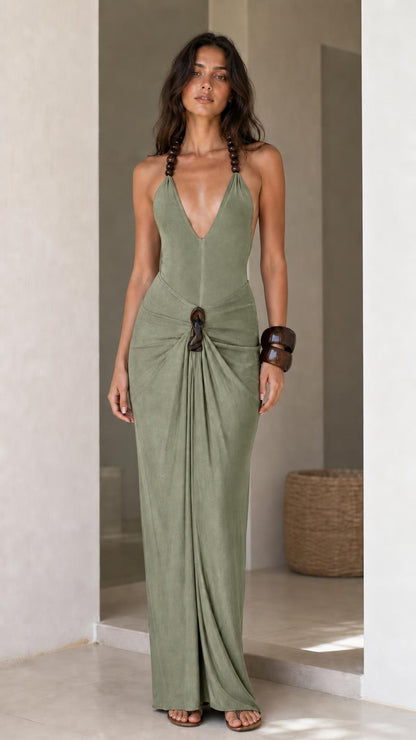 Model wearing sage green halter maxi dress