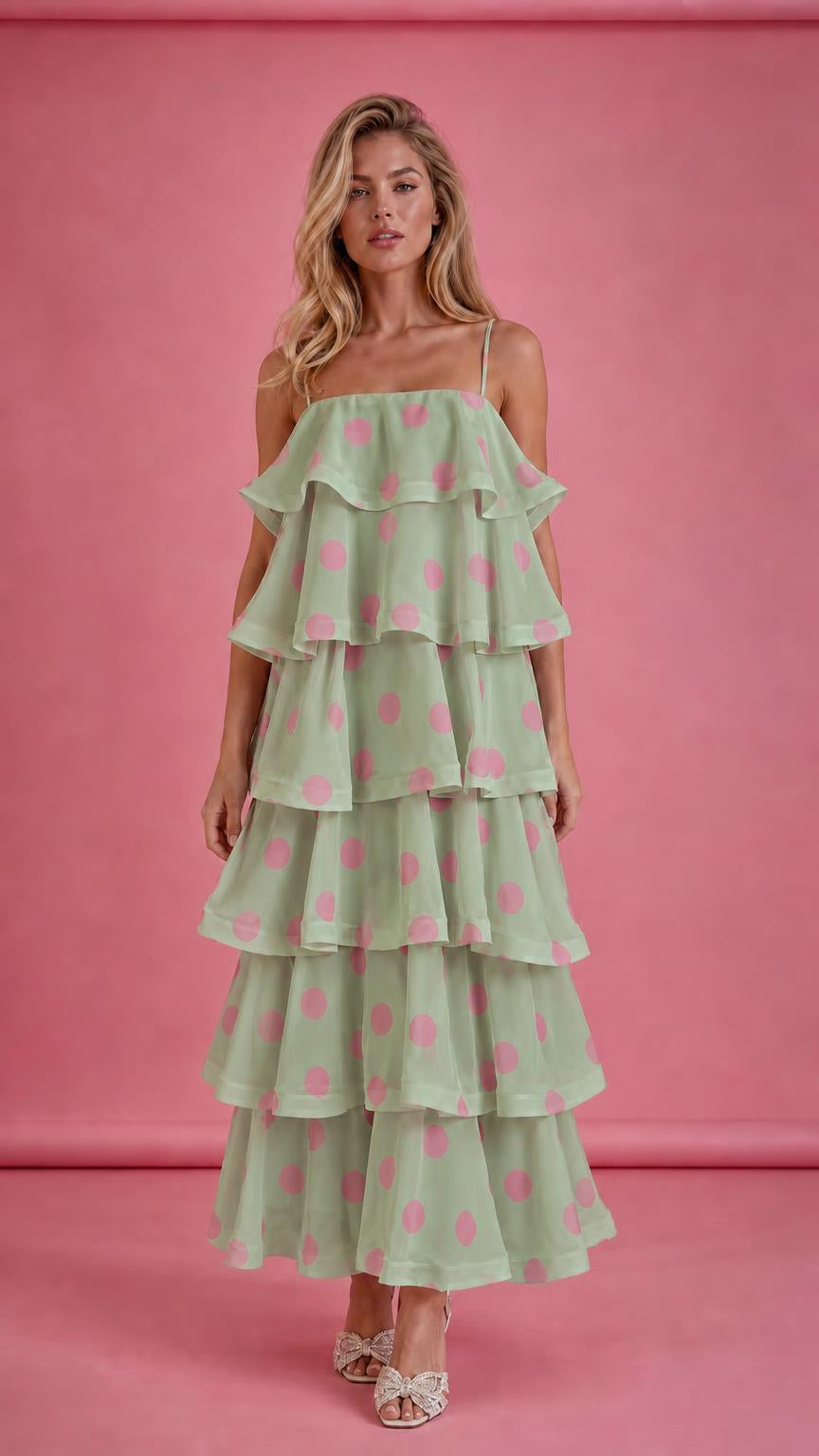 Model wearing sage green polka dot tiered ruffle midi dress