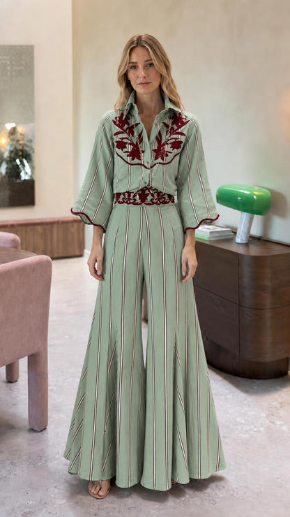 Front view of sage green striped embroidered wide leg jumpsuit