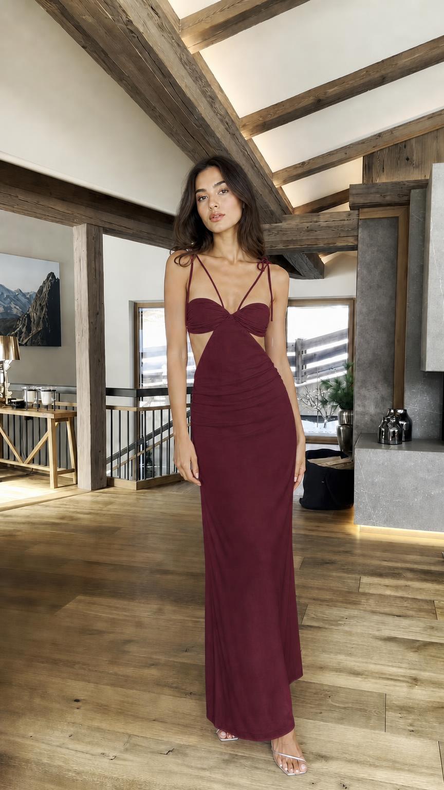 Model wearing burgundy cutout halter maxi dress