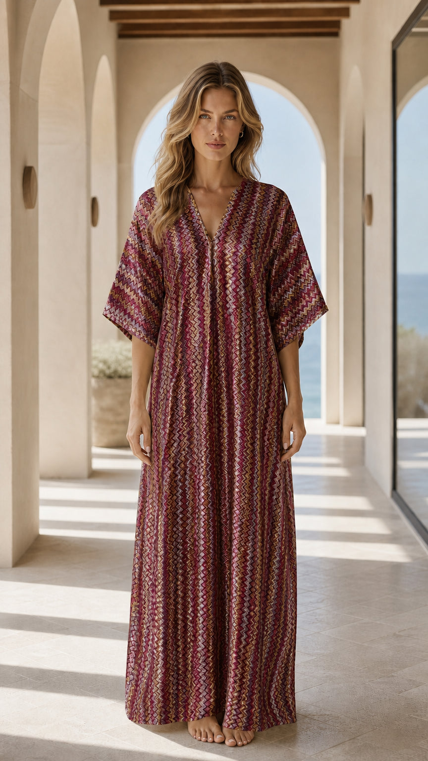 Front view of woman wearing burgundy chevron kaftan dress