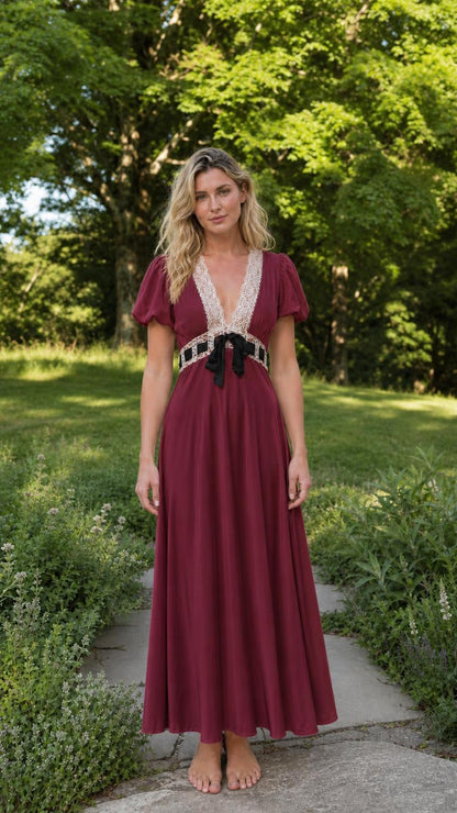 Front view of woman wearing burgundy V-neck lace trim maxi dress