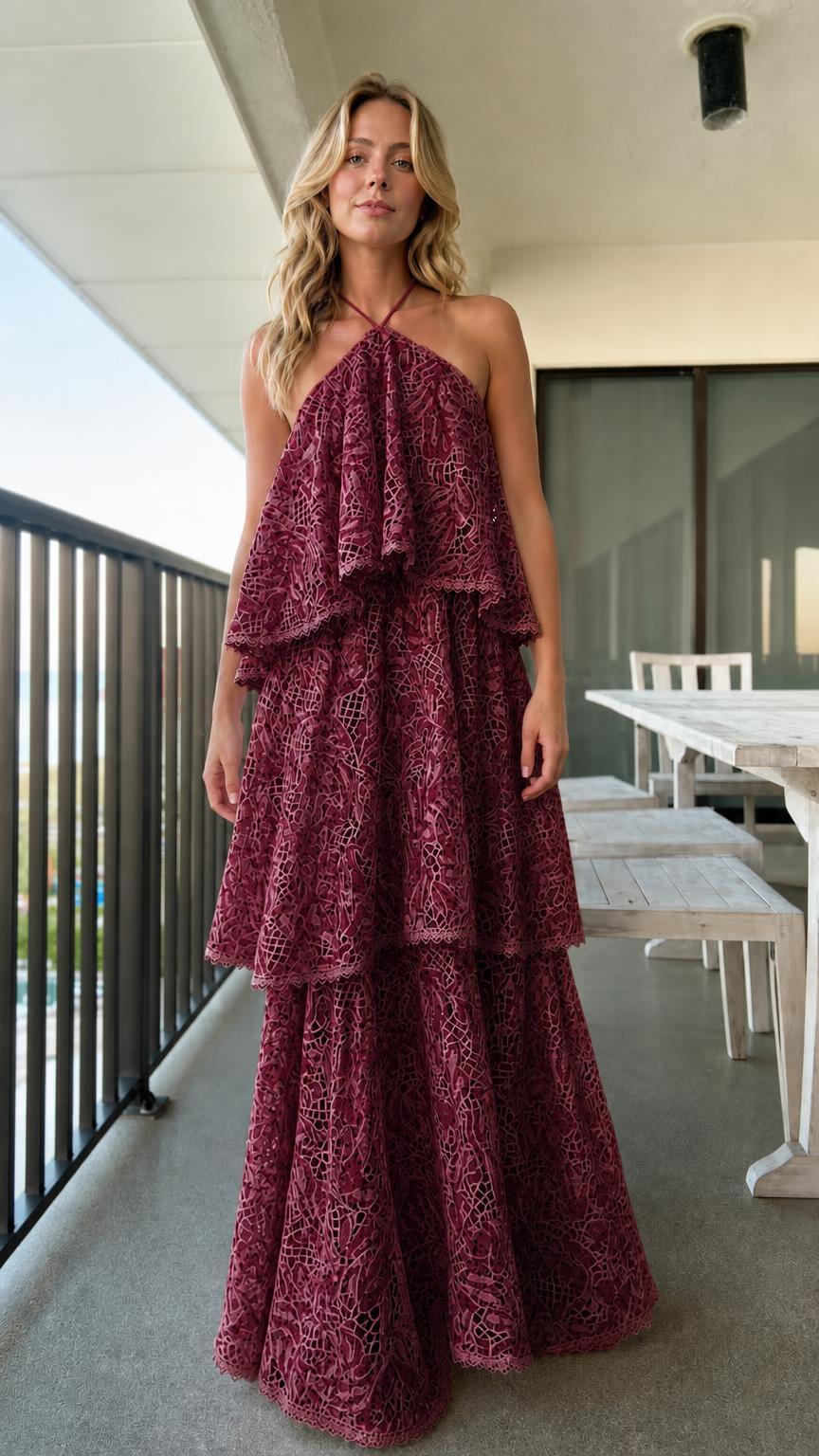 Model wearing burgundy tiered halter lace maxi dress
