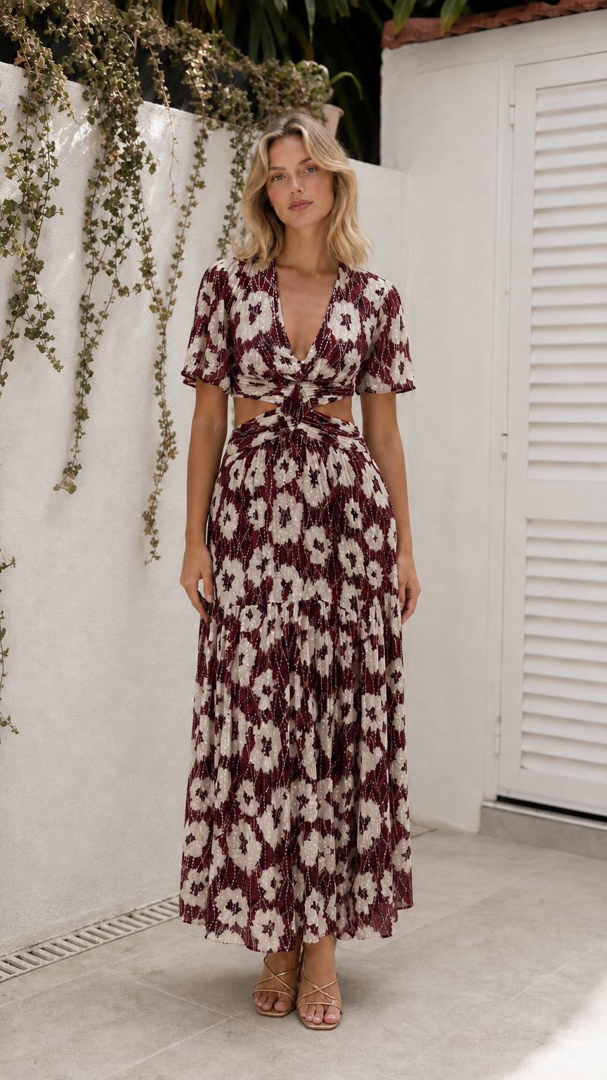 Model wearing burgundy floral cutout maxi dress