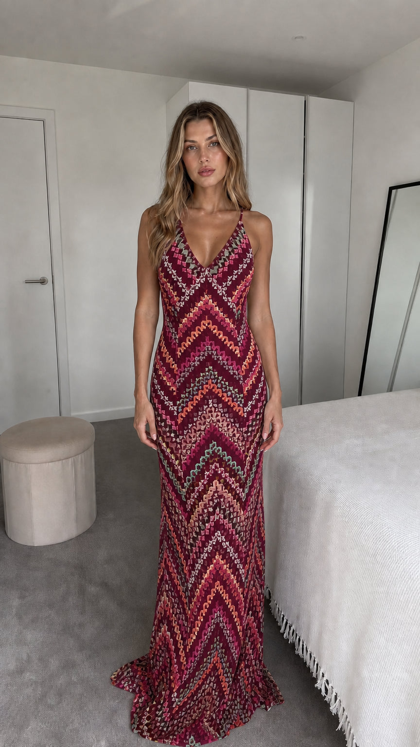 Front view of model wearing burgundy chevron maxi dress