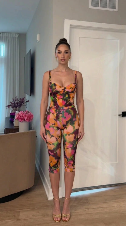 Front view of dark floral jumpsuit variant