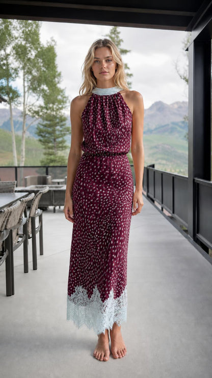 Front view of burgundy printed halter neck maxi dress