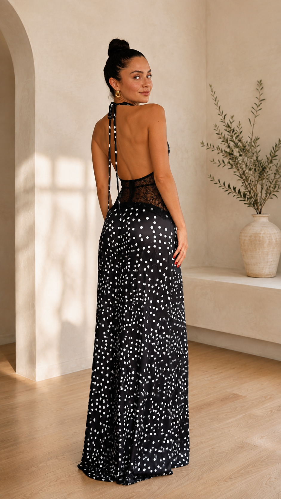 Back view of elegance polka dot halter lace maxi dress