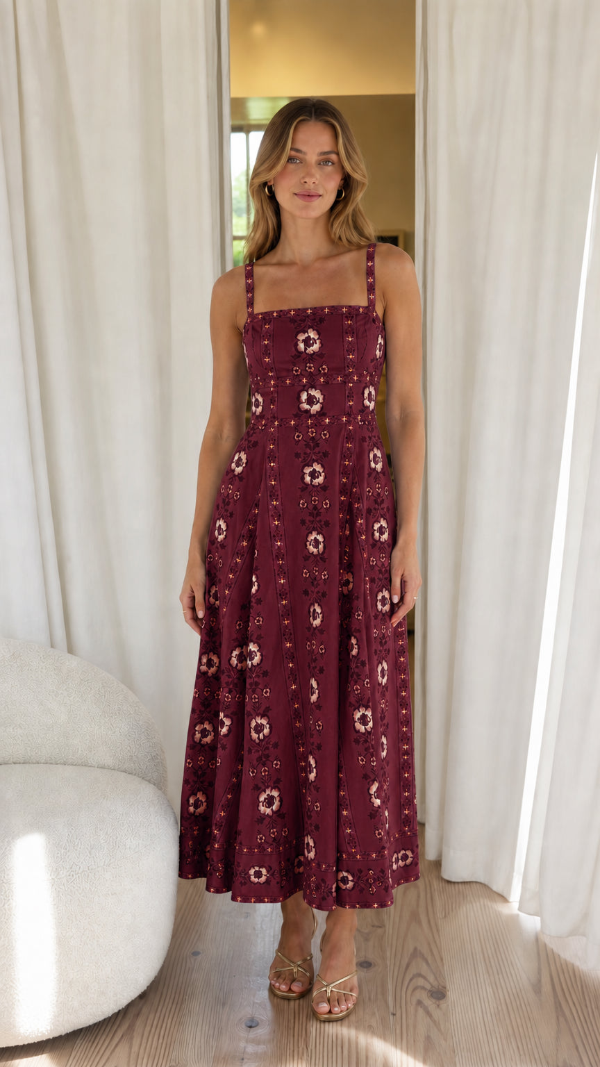 Woman wearing burgundy floral embroidered midi dress