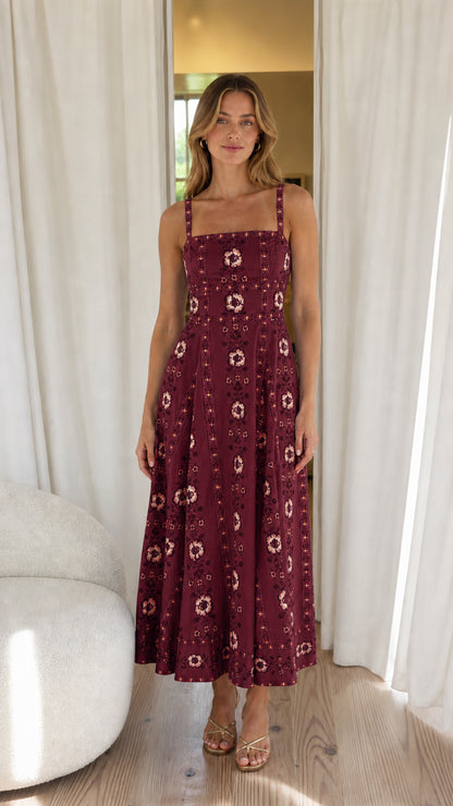Woman wearing burgundy floral embroidered midi dress