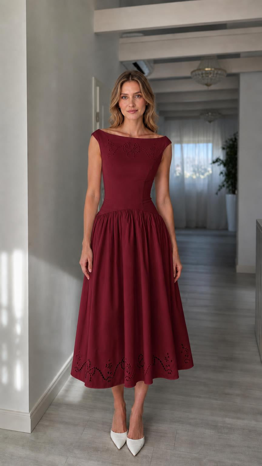 Full view of woman wearing burgundy boatneck midi dress