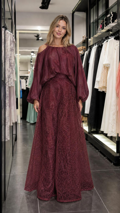 Model wearing burgundy two-piece set