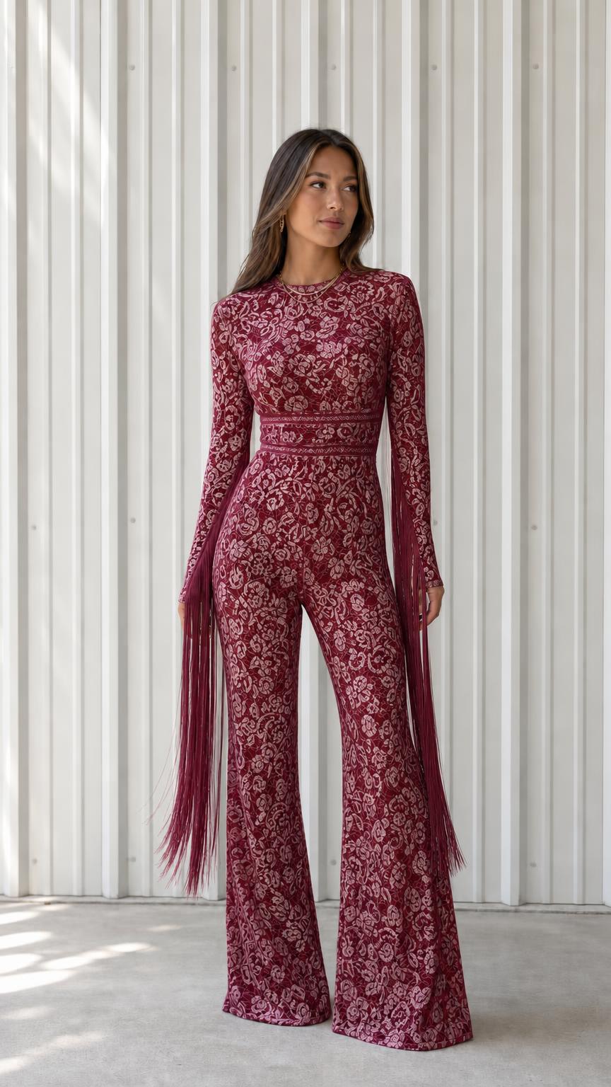Front view of woman wearing burgundy lace long sleeve wide leg jumpsuit