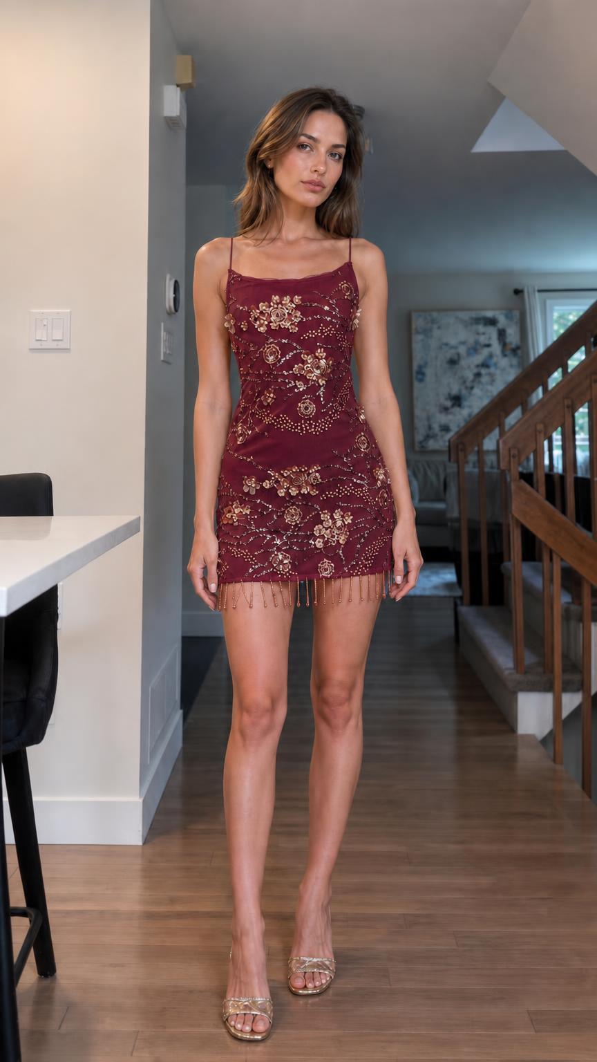 Model wearing burgundy embellished mini dress