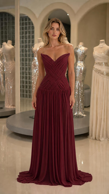 Front view of burgundy pleated strapless evening gown