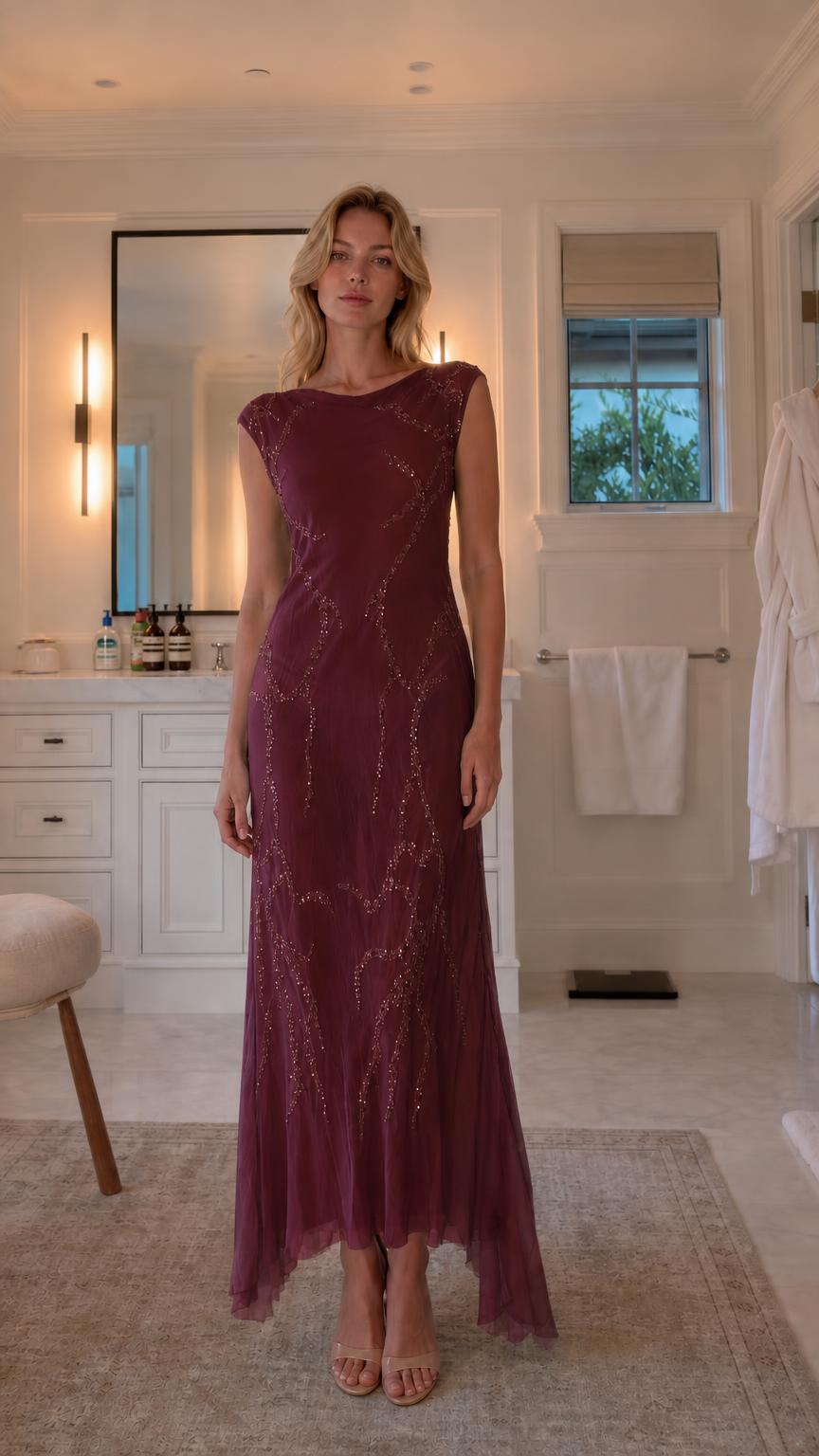 Front view of model wearing burgundy sequin maxi dress