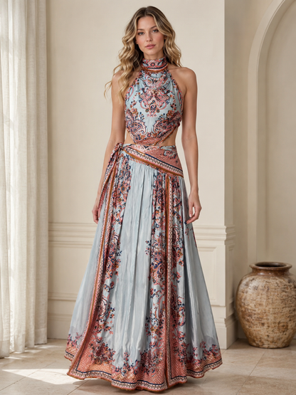 Front view of sky blue printed halter maxi dress with full pleated skirt
