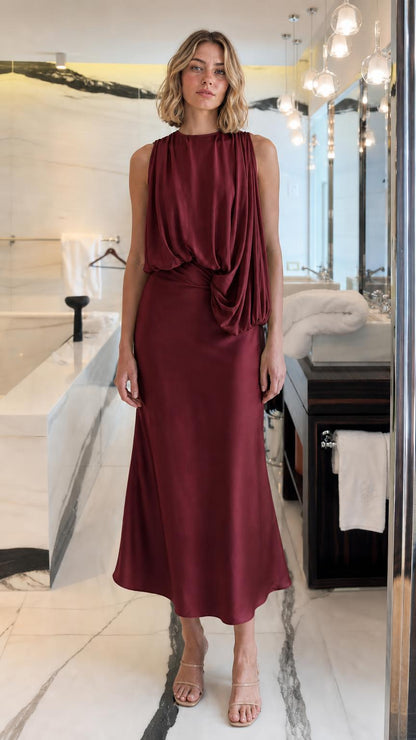 Front view of woman wearing Burgundy draped midi dress