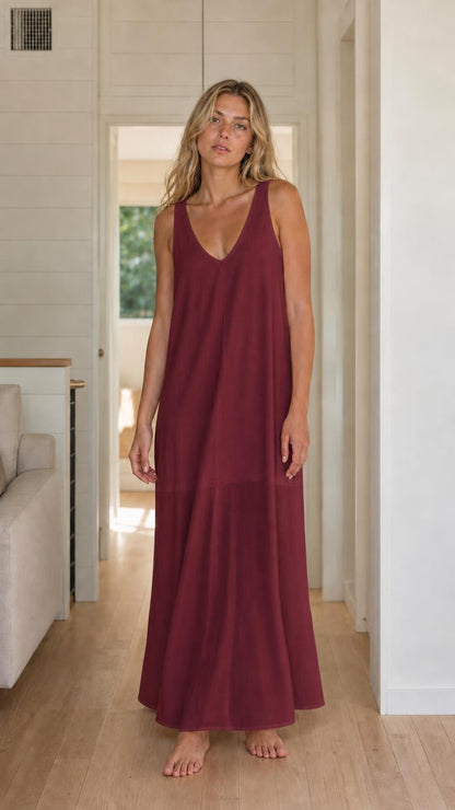 Front view of woman wearing burgundy sleeveless maxi dress