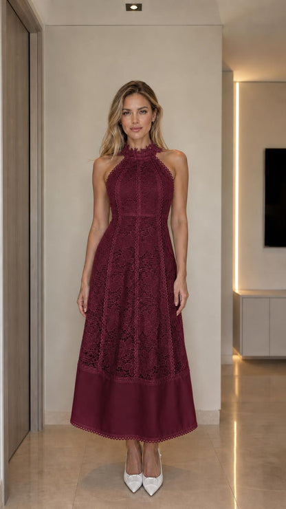 Front view of woman wearing burgundy halter neck lace midi dress