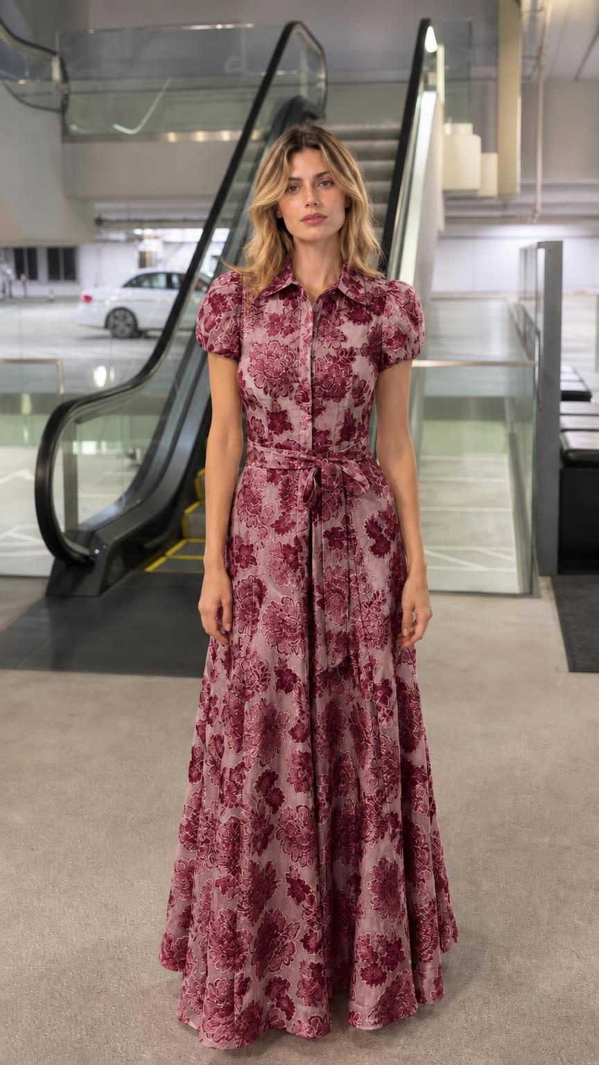 Front view of woman wearing burgundy floral jacquard maxi shirt dress