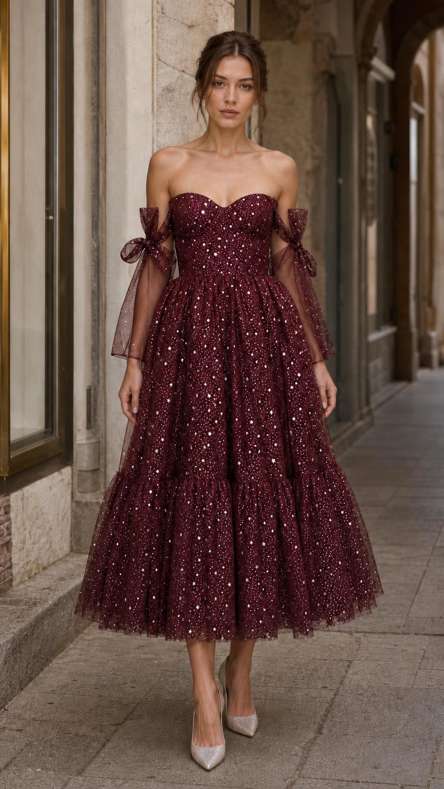 Model wearing burgundy starlight tulle midi dress