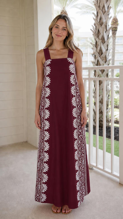Woman wearing burgundy maxi dress with side print panels