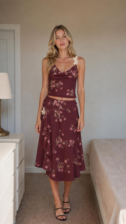 Front view of burgundy floral two-piece set on model