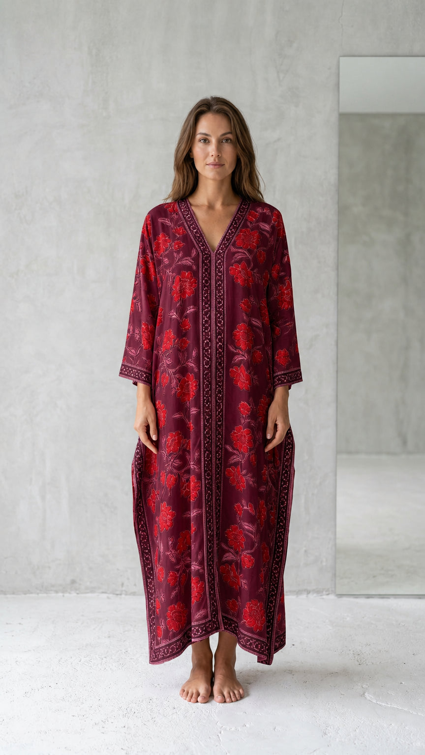 Front view of model wearing burgundy floral long kaftan maxi dress