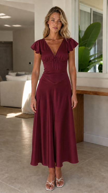 Front view of model wearing burgundy midi dress