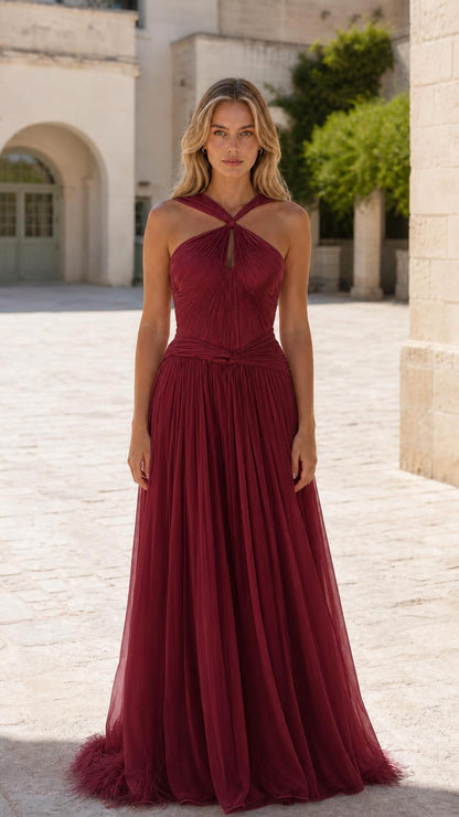 Front view of burgundy halter pleated tulle evening gown