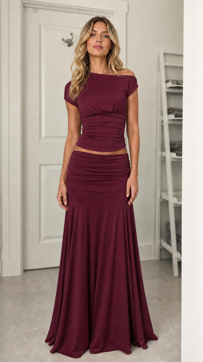 Model wearing burgundy ruched two-piece set