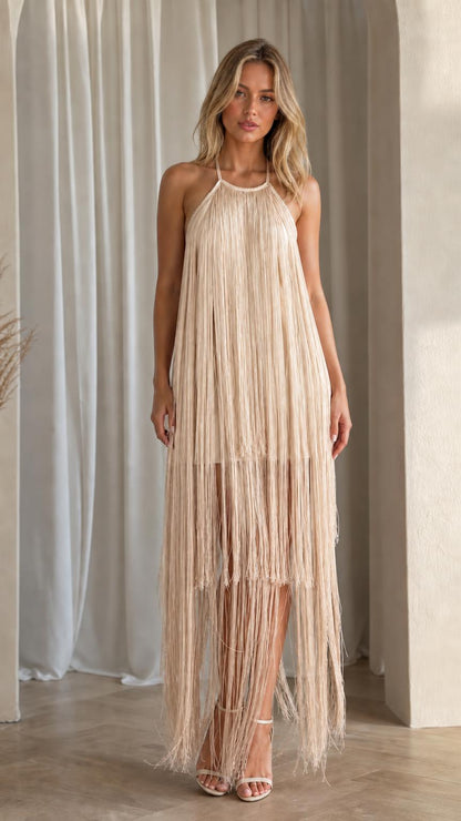 Front view of model wearing champagne fringe maxi dress