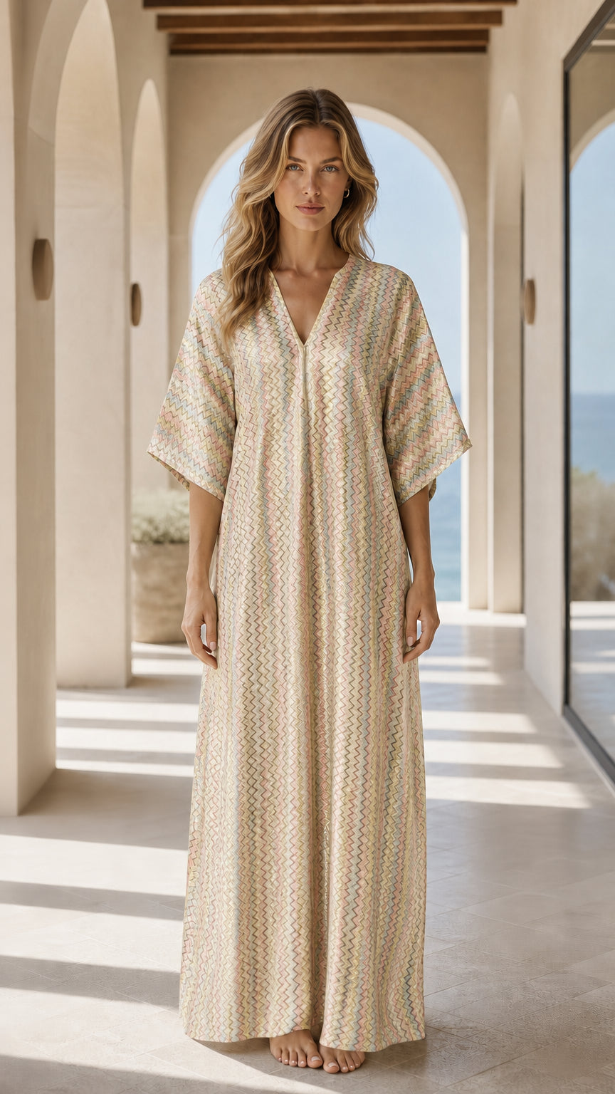 Front view of woman wearing champagne chevron kaftan dress