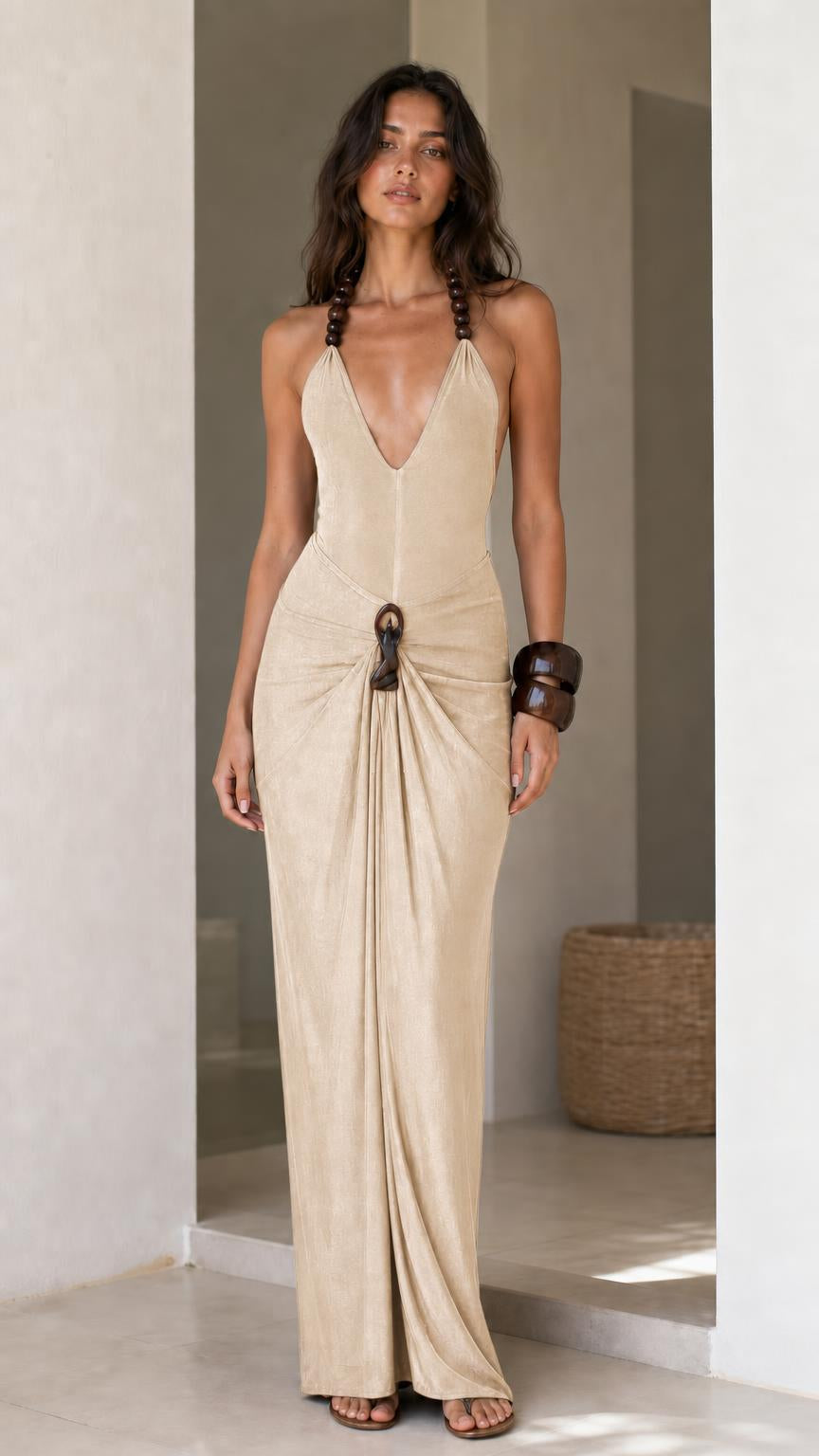 Model wearing beige halter maxi dress