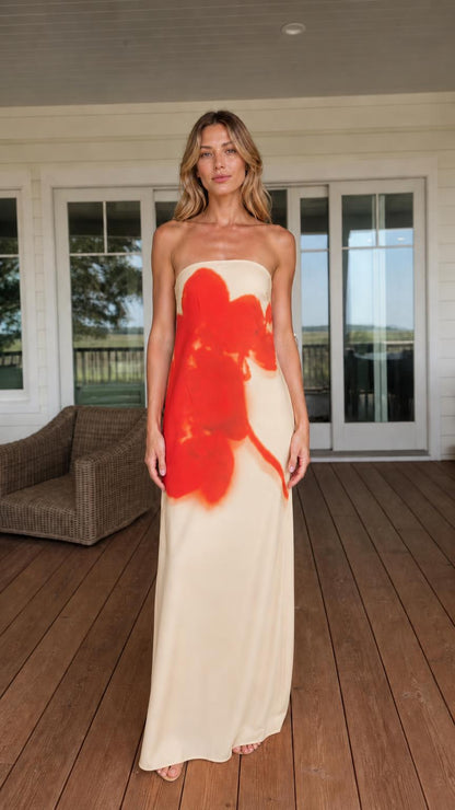 Woman wearing cream strapless abstract floral maxi dress