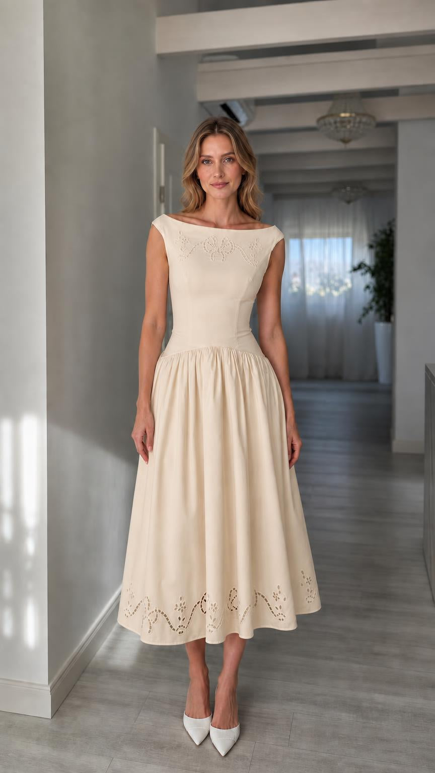 Full view of woman wearing champagne boatneck midi dress