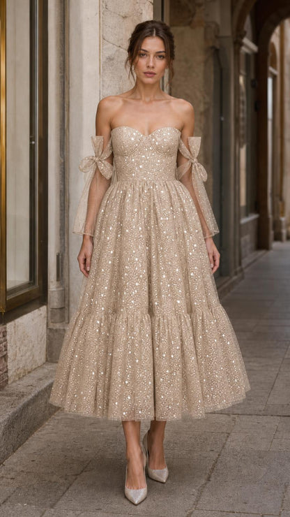 Model wearing champagne starlight tulle midi dress