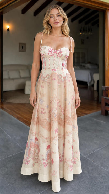Model wearing cream floral print corset maxi dress