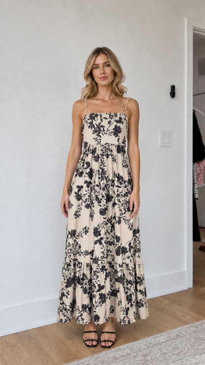 Model wearing beige floral maxi dress