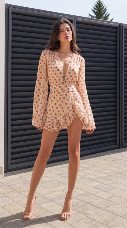 Full front view of model wearing champagne floral mini dress