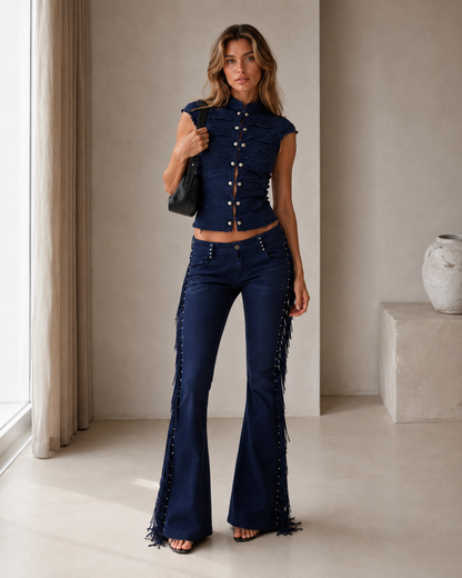 Model wearing a navy cap-sleeve crop top and matching flare pants