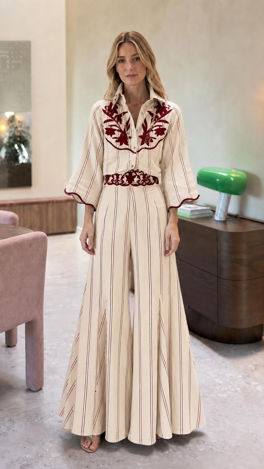 Front view of cream striped embroidered wide leg jumpsuit