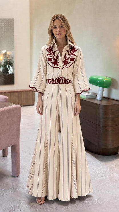 Front view of cream striped embroidered wide leg jumpsuit