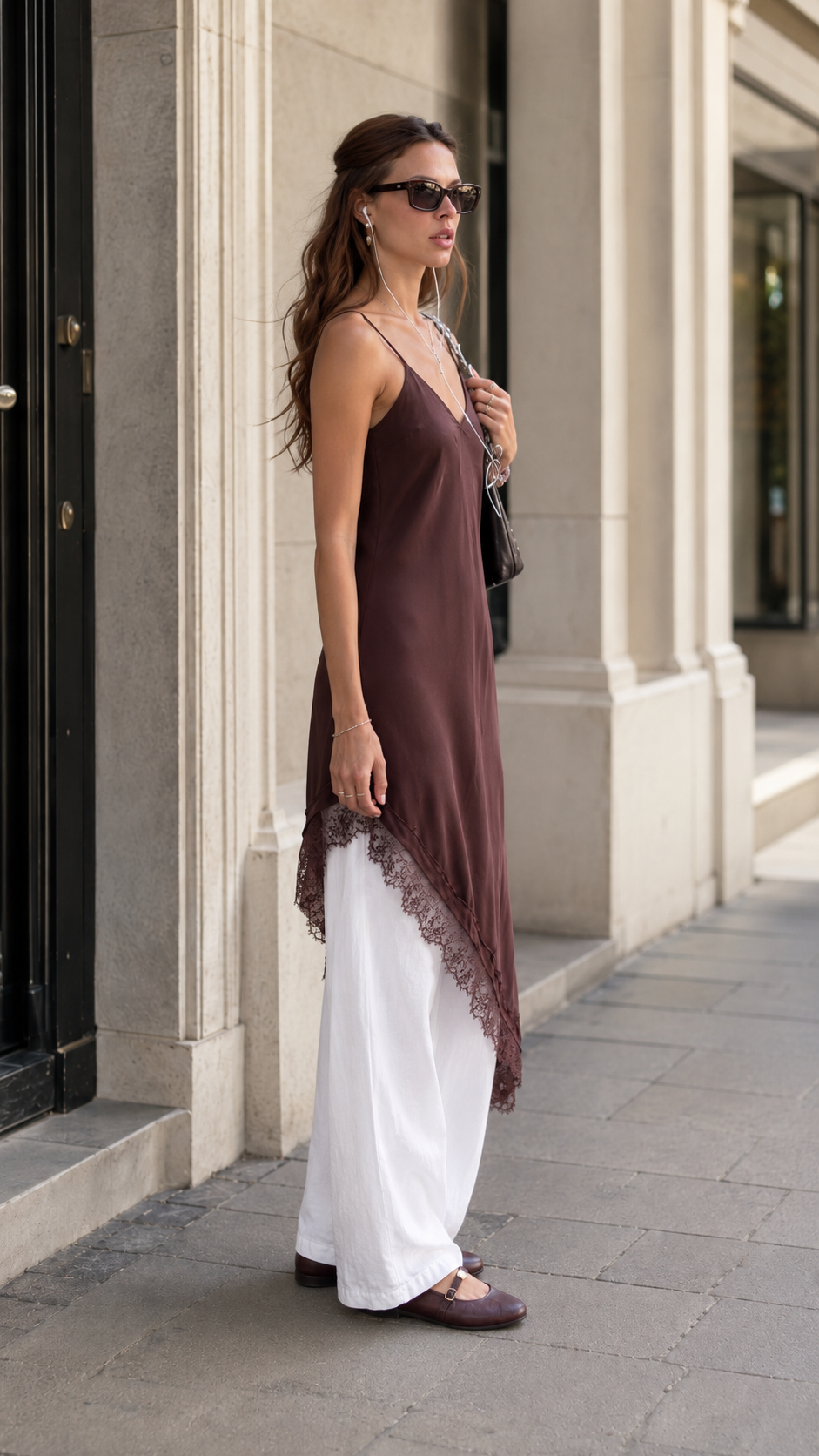 Side view of chocolate brown slip tunic dress showing asymmetric silhouette and lace edging