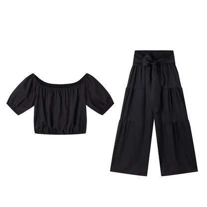 High-waisted Solid-color Flared Pants With Tie Detailing And A Flowing Drape